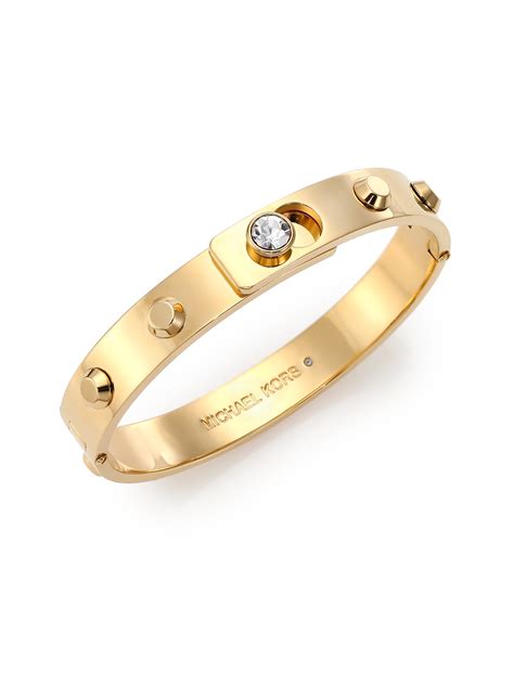 michael kors gold brangle|Michael Kors charm bracelet.